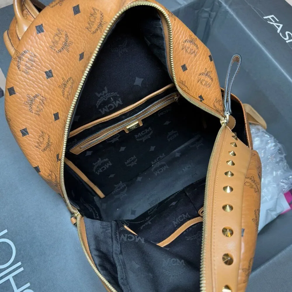MCM Visetos Studded Medium Stark M Logo Collection Backpack Cognac Monogram